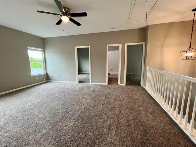 a view of empty room with windows