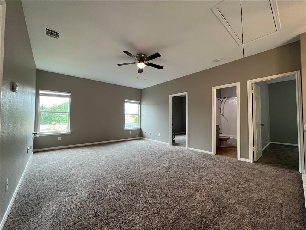 1706 Winners Ribbon Circle Pflugerville, TX 78660 - Photo 14 of 21 a view of a livingroom with a ceiling fan and window