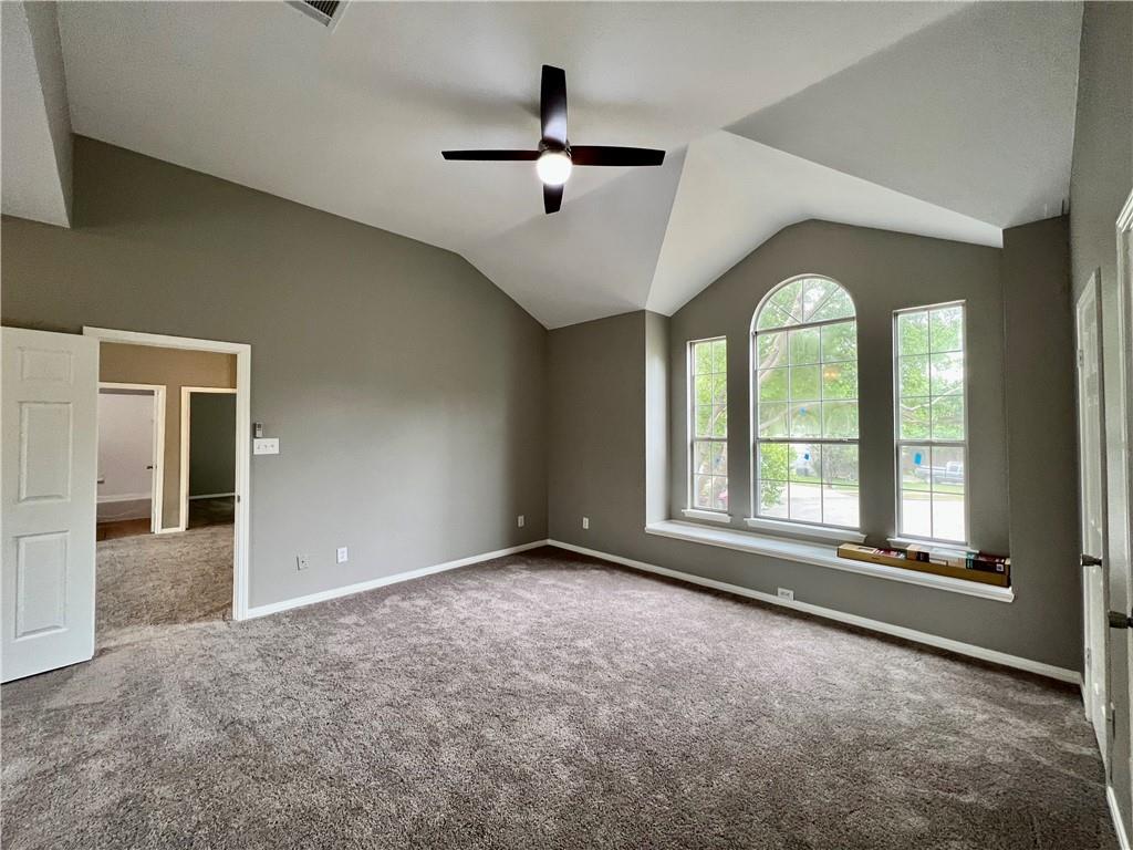 1706 Winners Ribbon Circle Pflugerville, TX 78660 - Photo 19 of 21 an empty room with large windows and ceiling fan