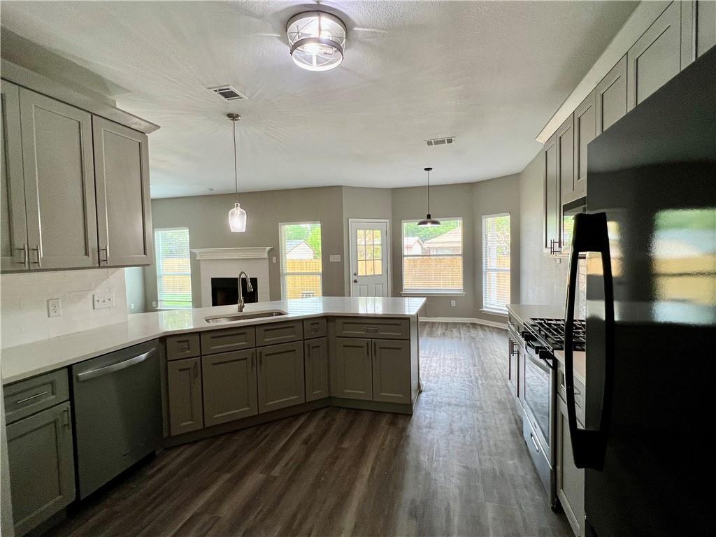 1706 Winners Ribbon Circle Pflugerville, TX 78660 - Photo 7 of 21 a large kitchen with lots of counter space and a sink