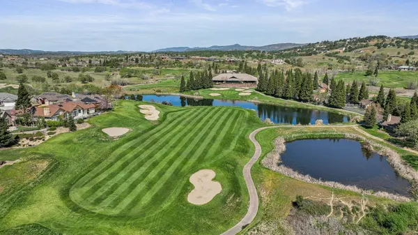 a view of a lake with a yard
