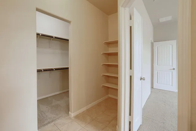 a bathroom with a double vanity sink and mirror