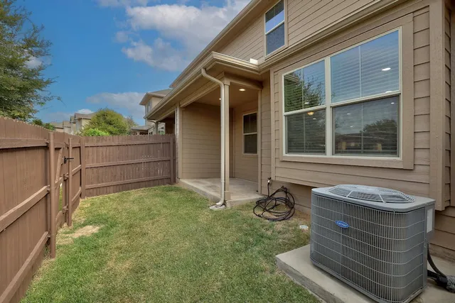 a view of backyard with window and porch