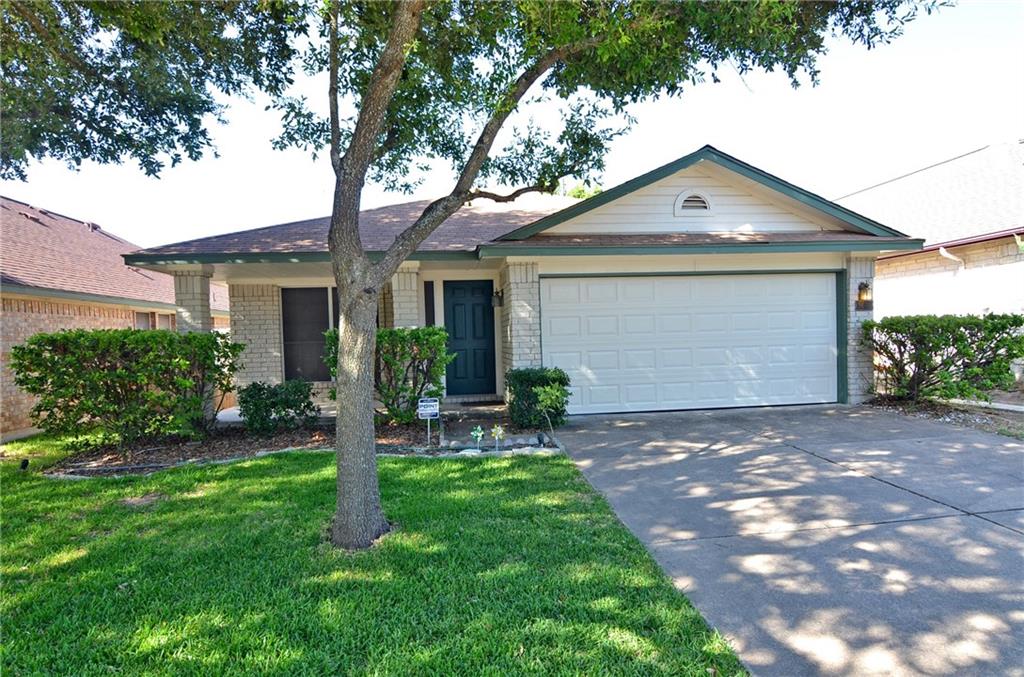 3609 Ruby Red Drive Austin, TX 78728 - Photo 1 of 21 Ranch-style home featuring brick siding, concrete driveway, a front lawn, and an attached garage