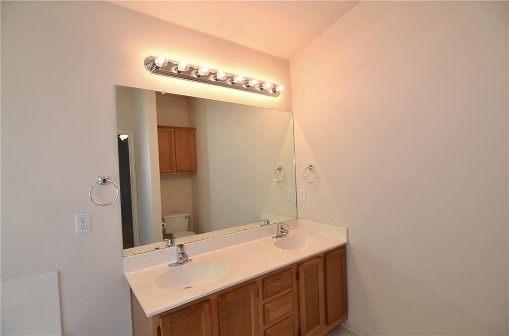 3609 Ruby Red Drive Austin, TX 78728 - Photo 11 of 21 Bathroom featuring double vanity and toilet