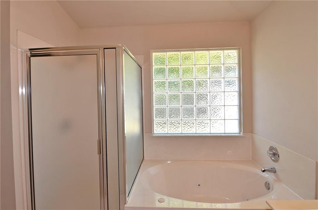 3609 Ruby Red Drive Austin, TX 78728 - Photo 12 of 21 Full bathroom featuring a jetted tub and a stall shower