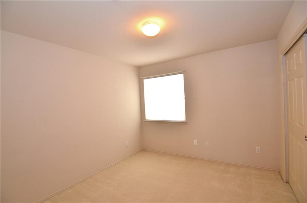 3609 Ruby Red Drive Austin, TX 78728 - Photo 15 of 21 Unfurnished bedroom featuring a closet and light colored carpet