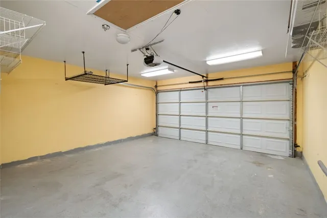 a front view of a house with yard and green space