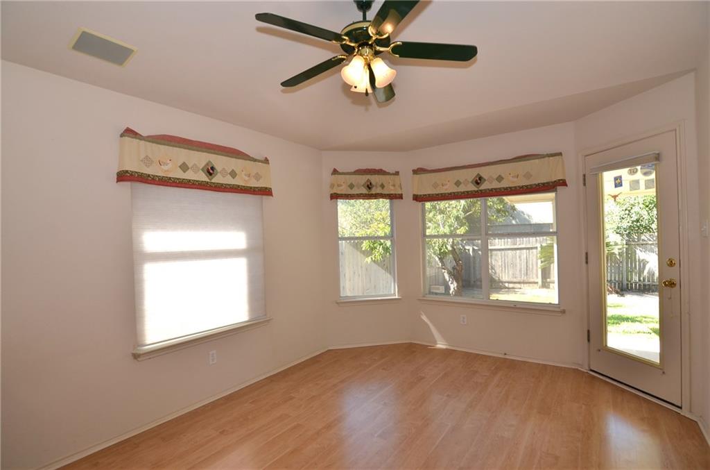 3609 Ruby Red Drive Austin, TX 78728 - Photo 7 of 21 Unfurnished room featuring light wood-type flooring and ceiling fan