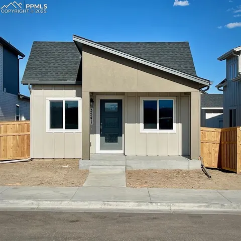 a front view of a house with garage