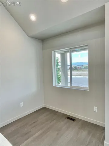 a front view of a house with parking space