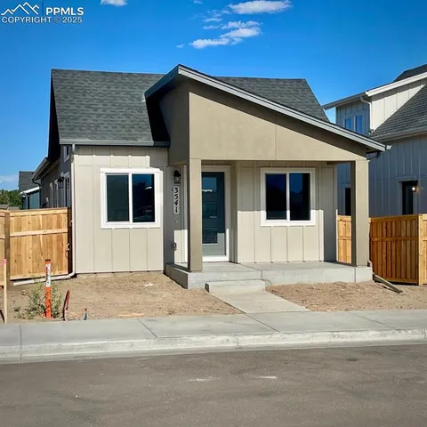 a front view of a house with a garage