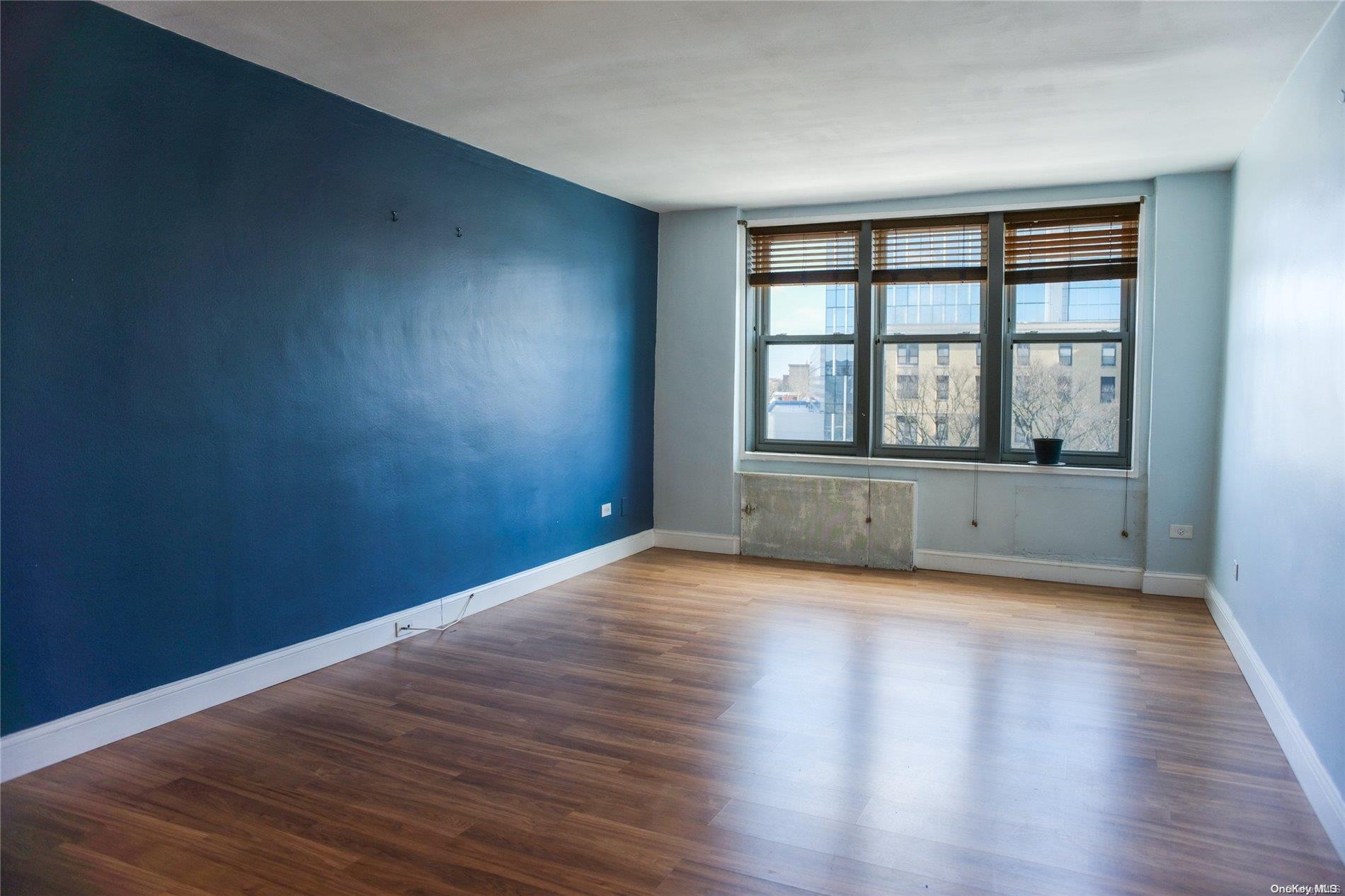 2610 Ocean Parkway Brooklyn, NY 11235 - Photo 1 of 4 a view of a room with wooden floor and a window