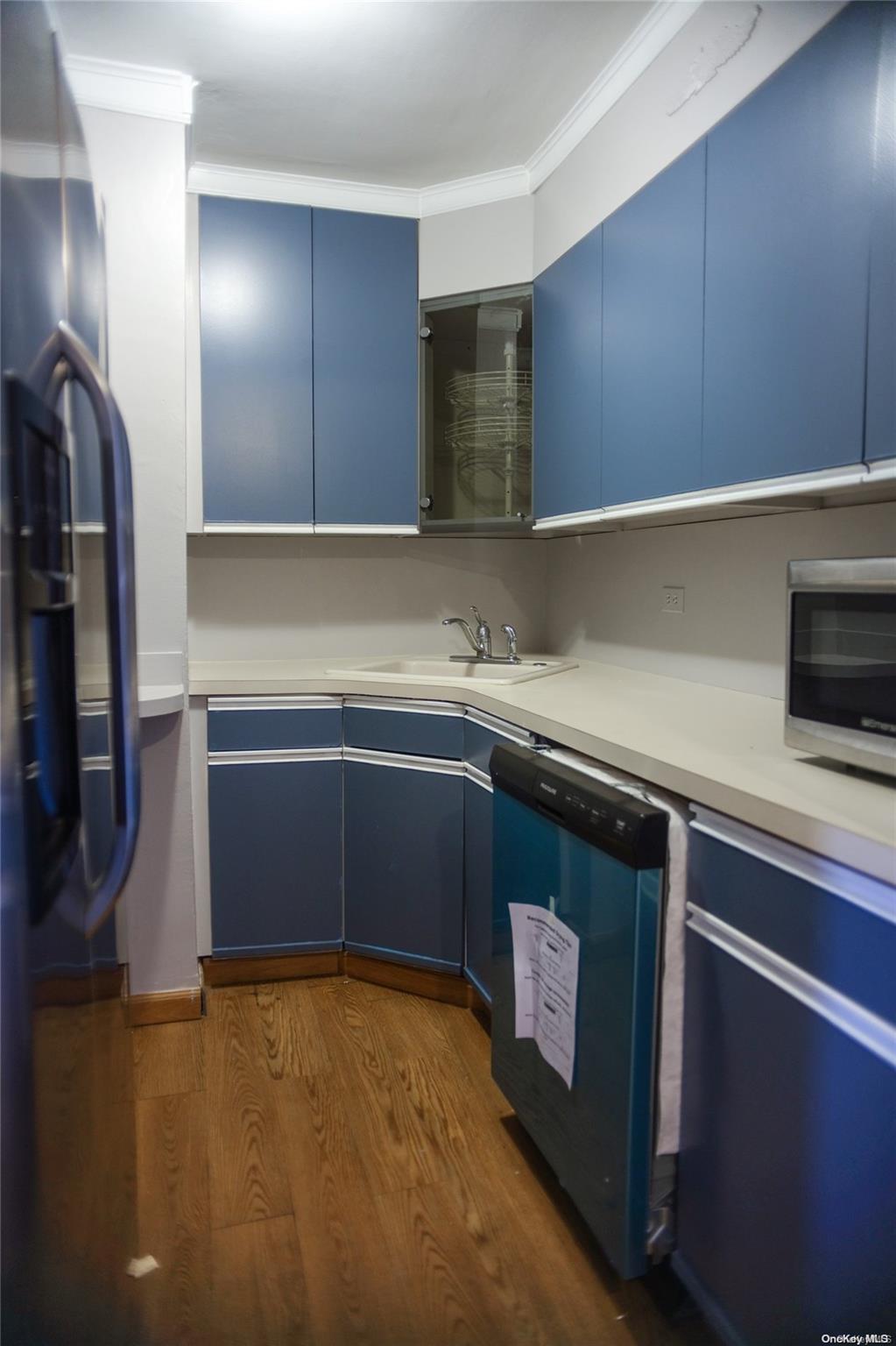 2610 Ocean Parkway Brooklyn, NY 11235 - Photo 3 of 4 a kitchen with stainless steel appliances a sink dishwasher stove and oven