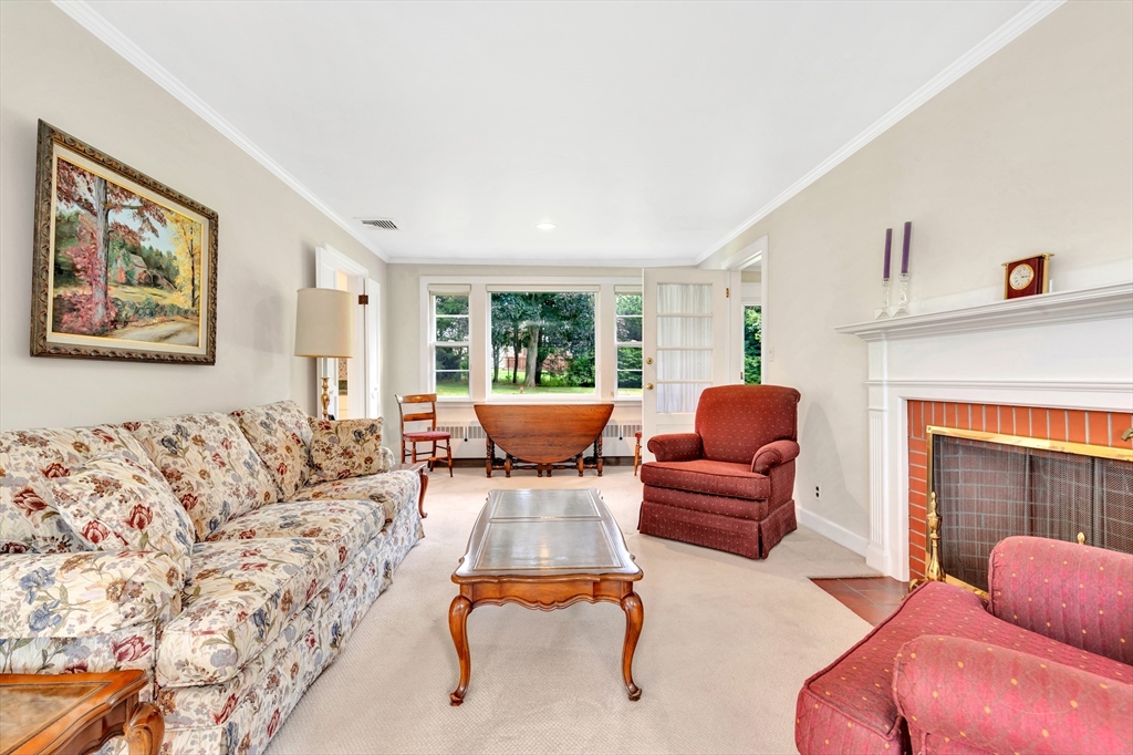 21 Gleason Road Lexington, MA 02420 - Photo 15 of 42 a living room with furniture and a fireplace