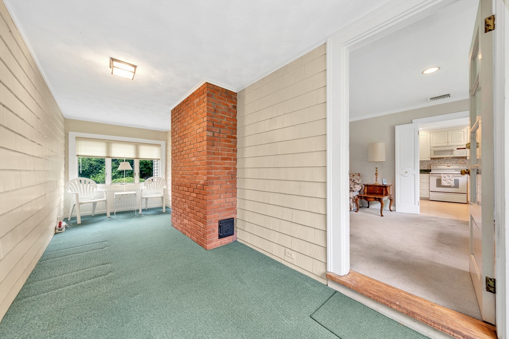 21 Gleason Road Lexington, MA 02420 - Photo 18 of 42 a view of a hallway with wooden floor and windows