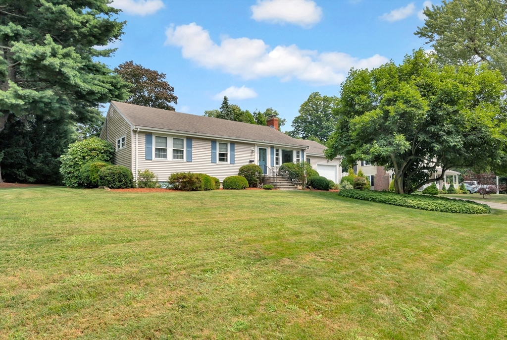 21 Gleason Road Lexington, MA 02420 - Photo 2 of 42 a front view of house with yard and green space