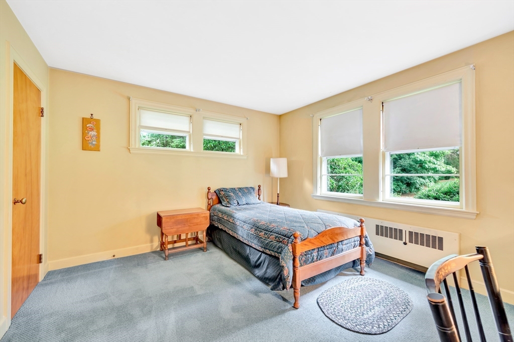 21 Gleason Road Lexington, MA 02420 - Photo 30 of 42 a bed room with a bed and a window