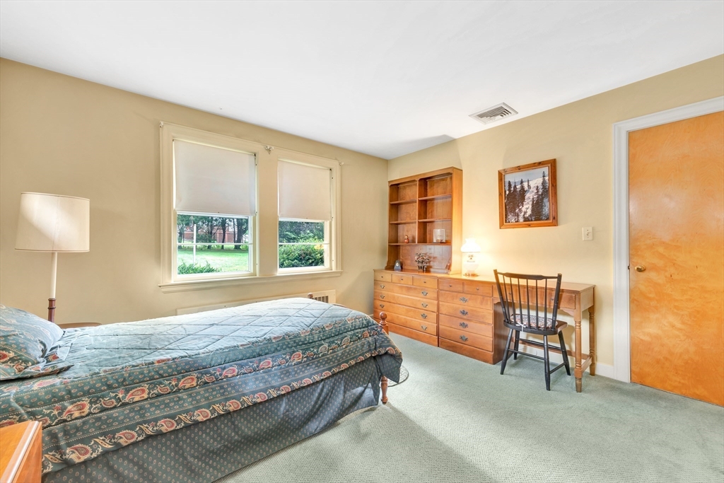 21 Gleason Road Lexington, MA 02420 - Photo 31 of 42 a bedroom with a bed and a couch