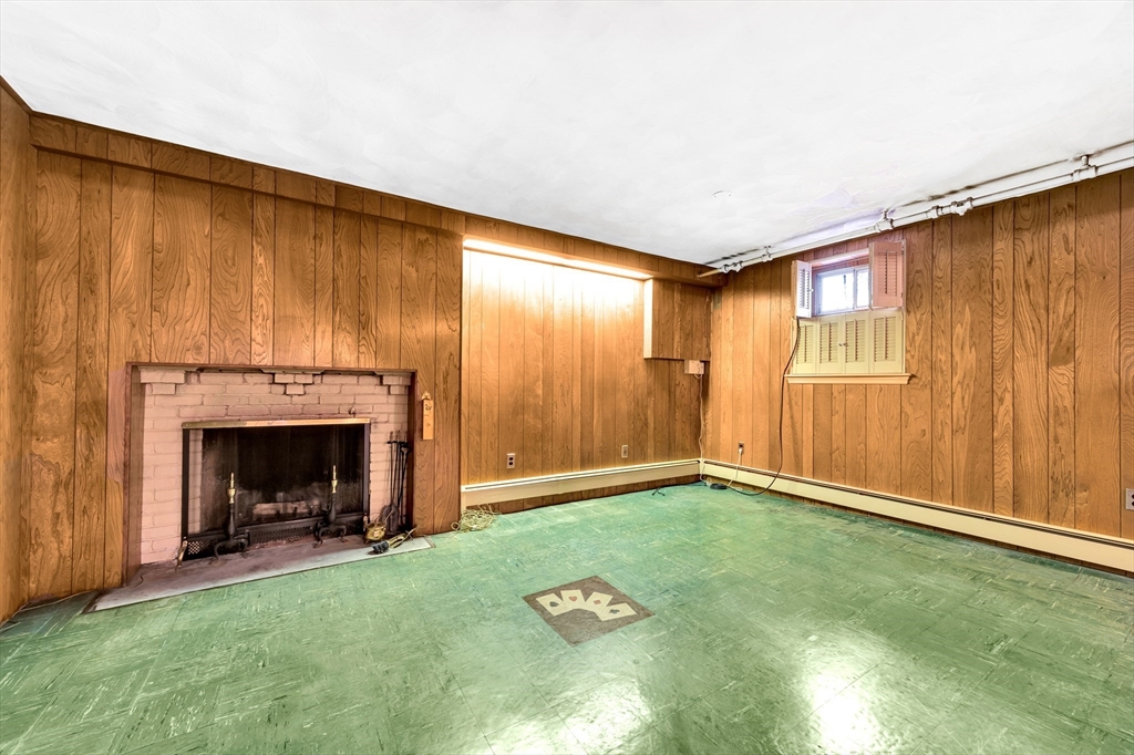 21 Gleason Road Lexington, MA 02420 - Photo 37 of 42 a view of an empty room and fire place