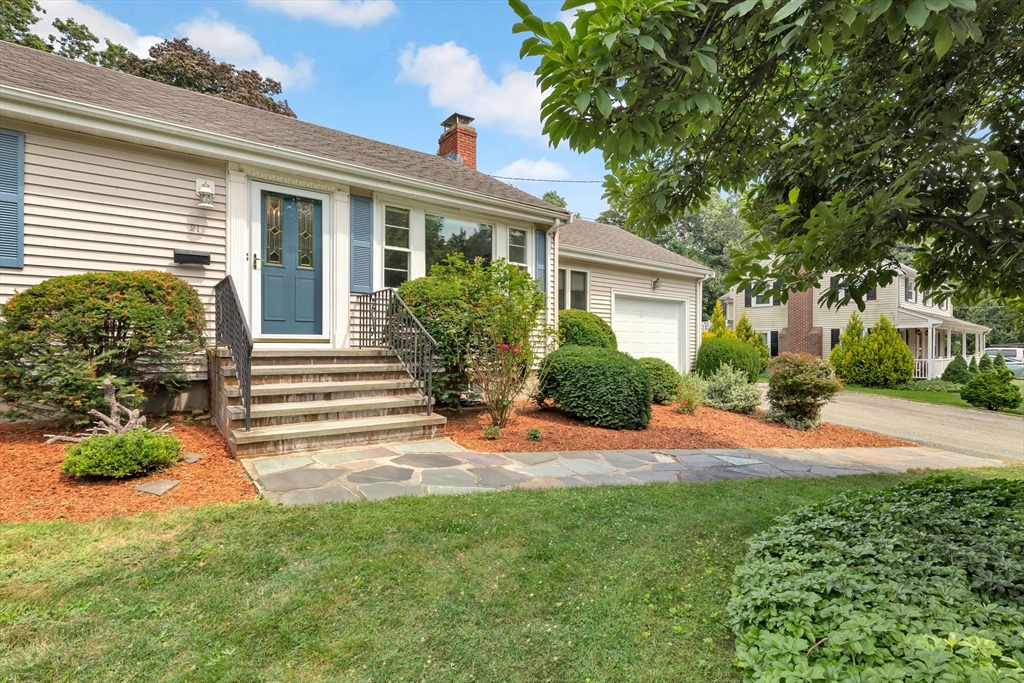 21 Gleason Road Lexington, MA 02420 - Photo 4 of 42 a front view of a house with a yard and potted plants