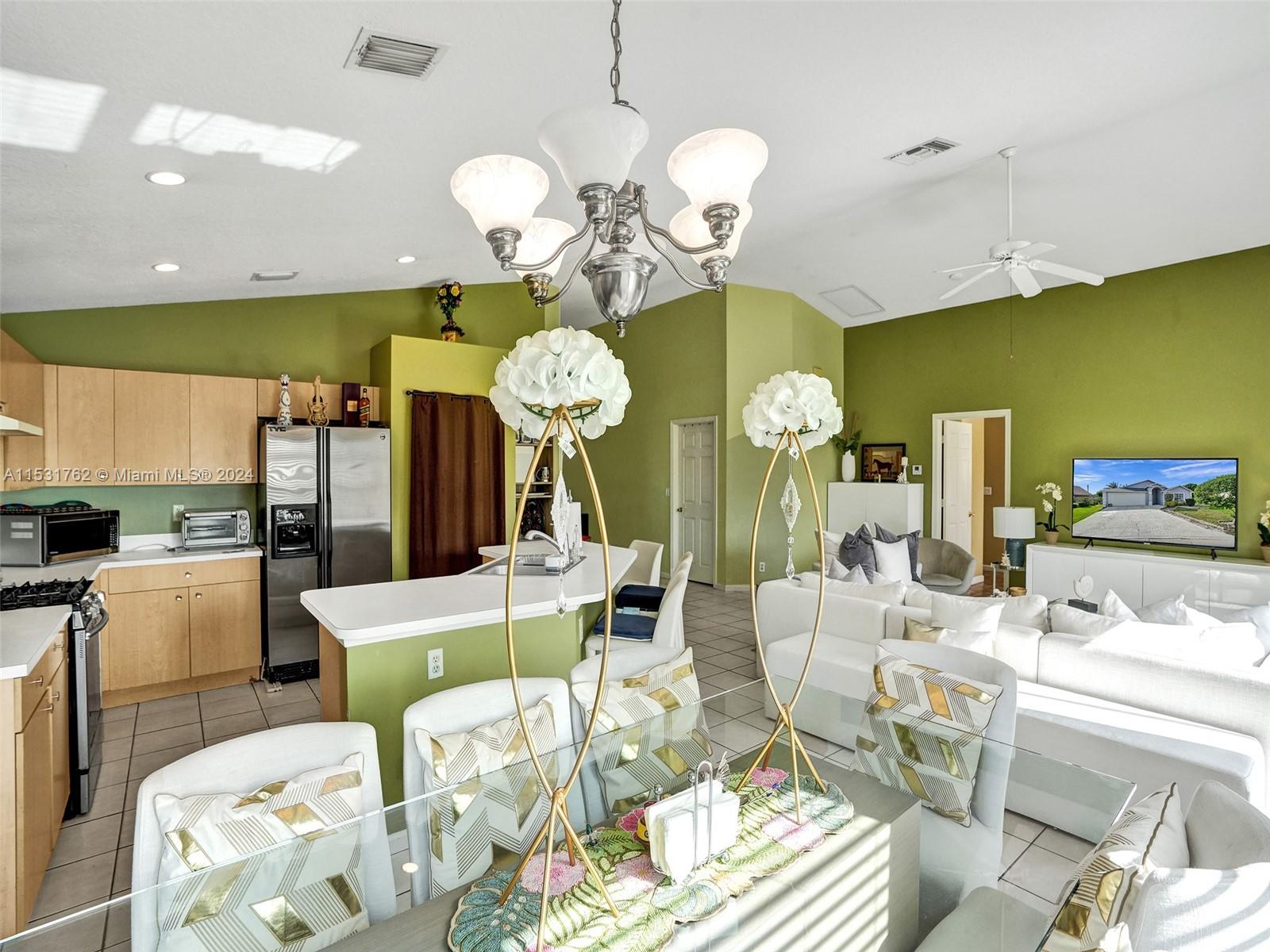 Greenacres Greenacres, FL 33413 - Photo 16 of 61 a living room with fireplace furniture and a chandelier