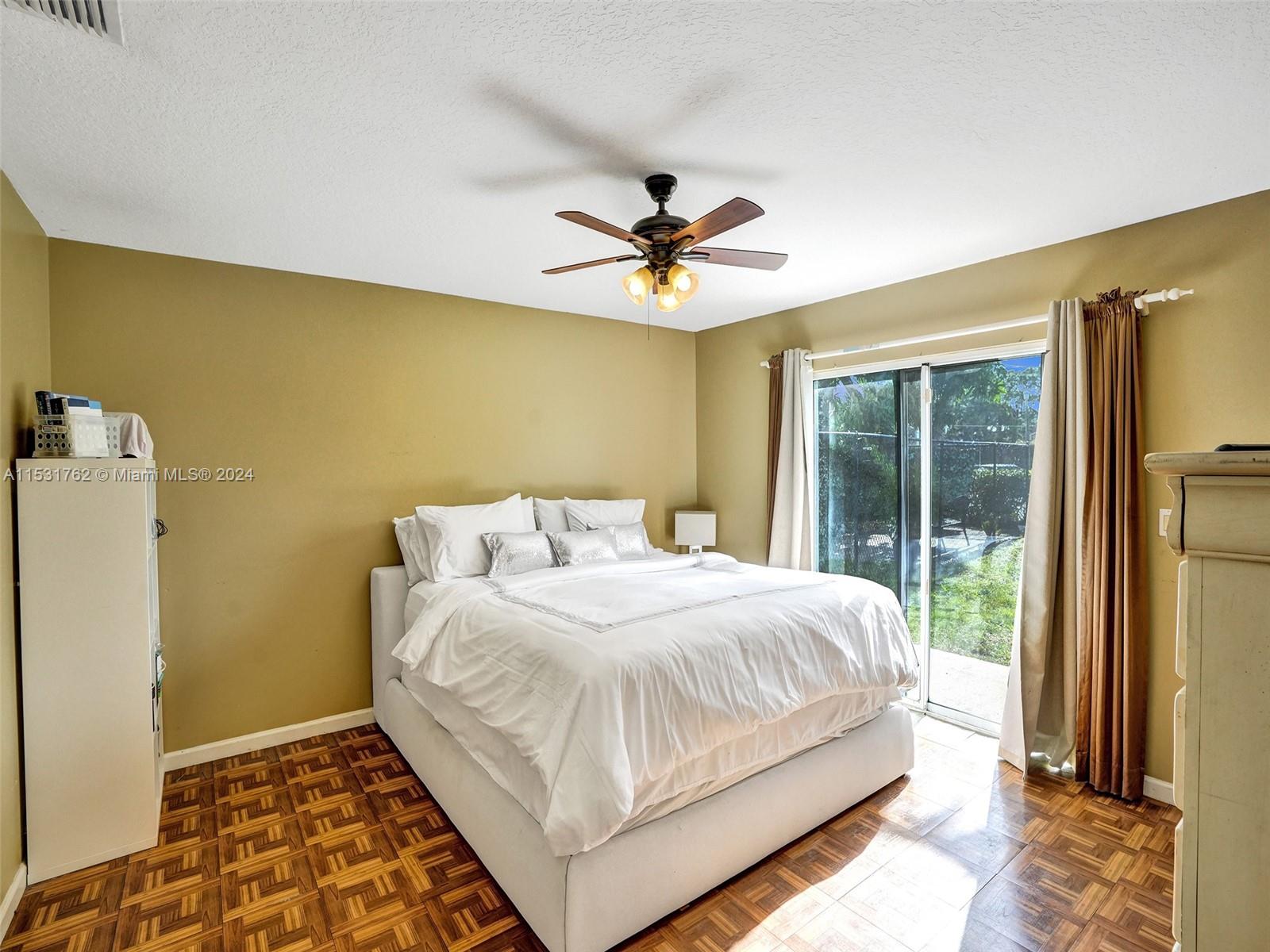 Greenacres Greenacres, FL 33413 - Photo 21 of 61 a bedroom with a bed and a window