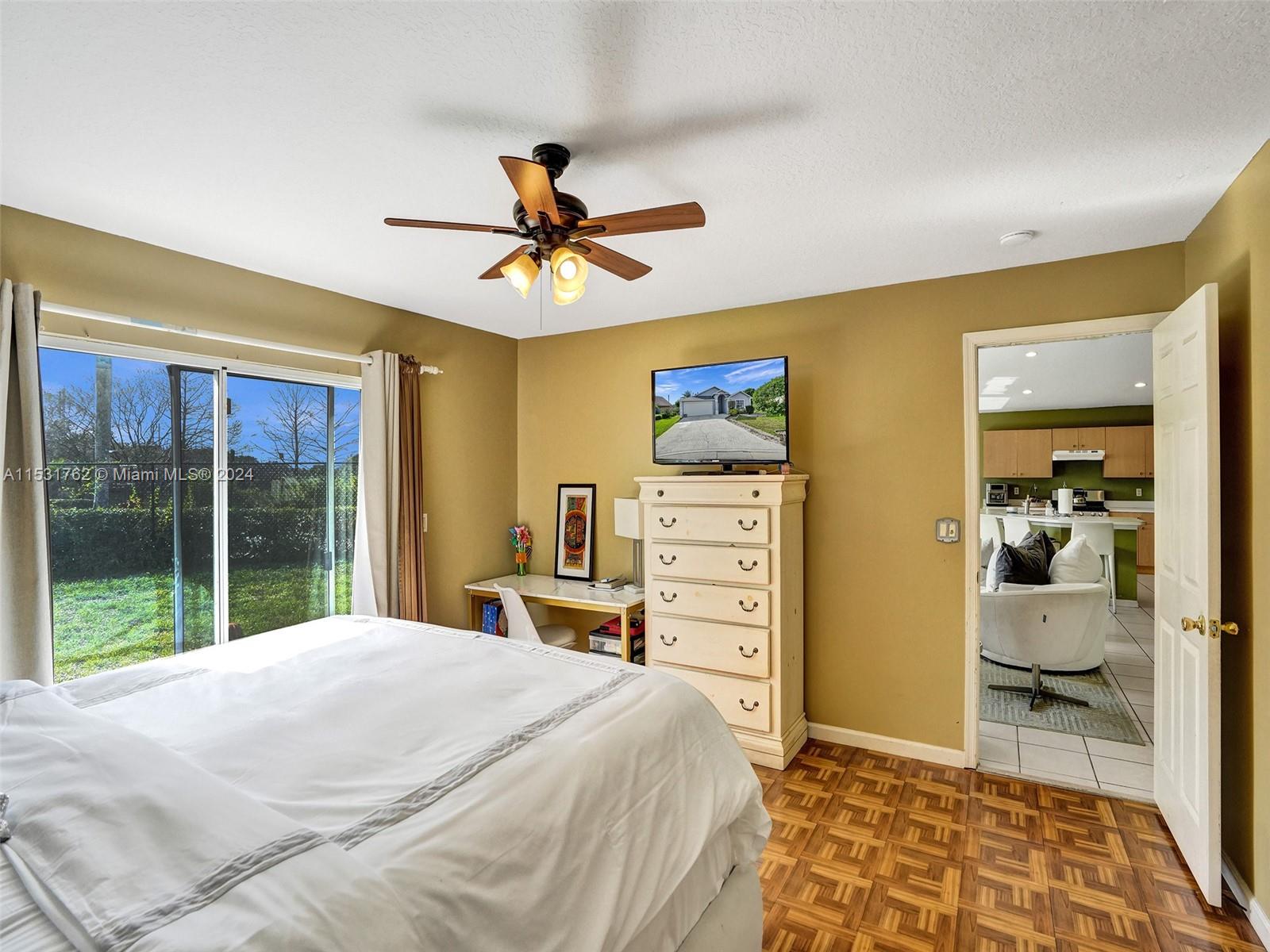 Greenacres Greenacres, FL 33413 - Photo 23 of 61 a bedroom with a bed and a dresser