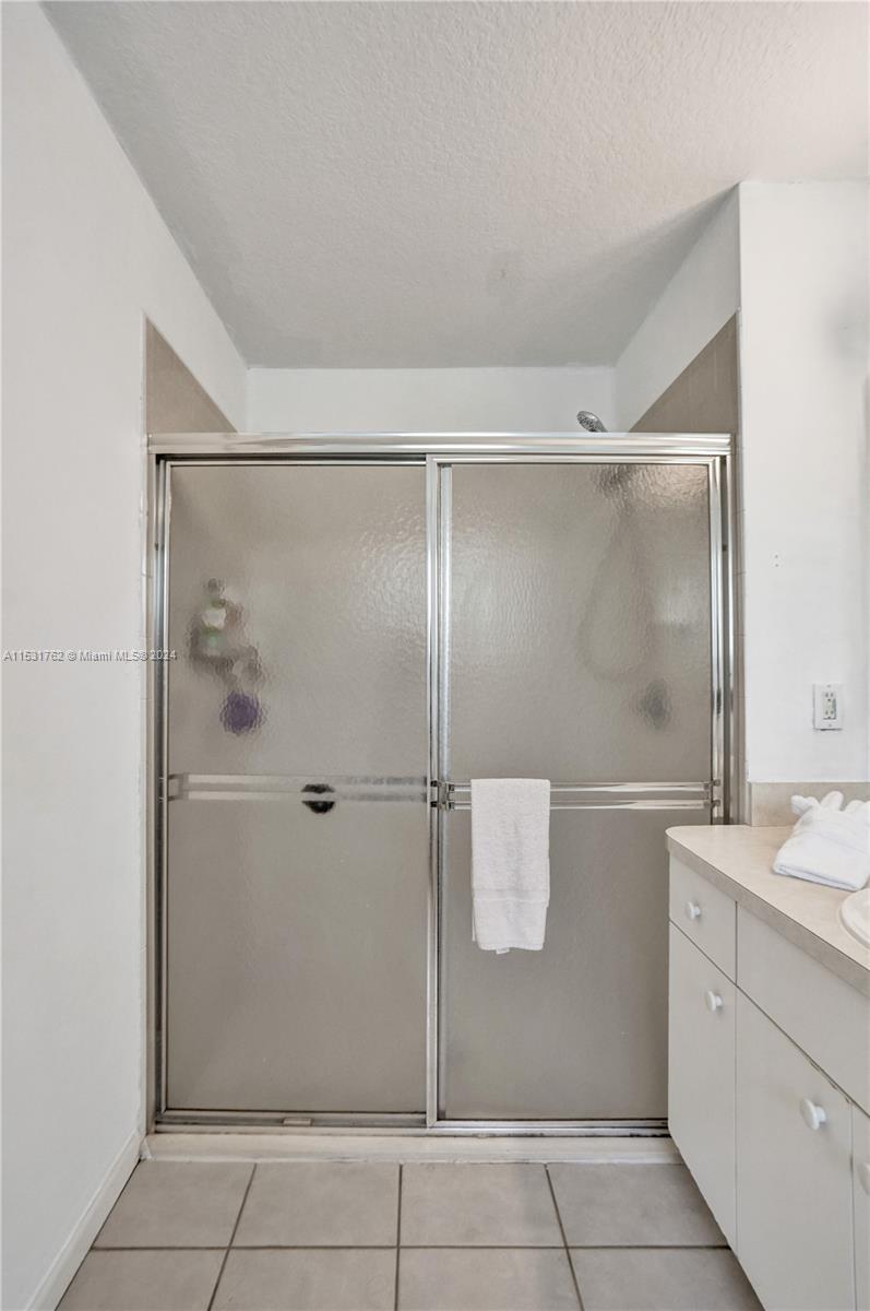 Greenacres Greenacres, FL 33413 - Photo 30 of 61 a bathroom with a shower and mirror