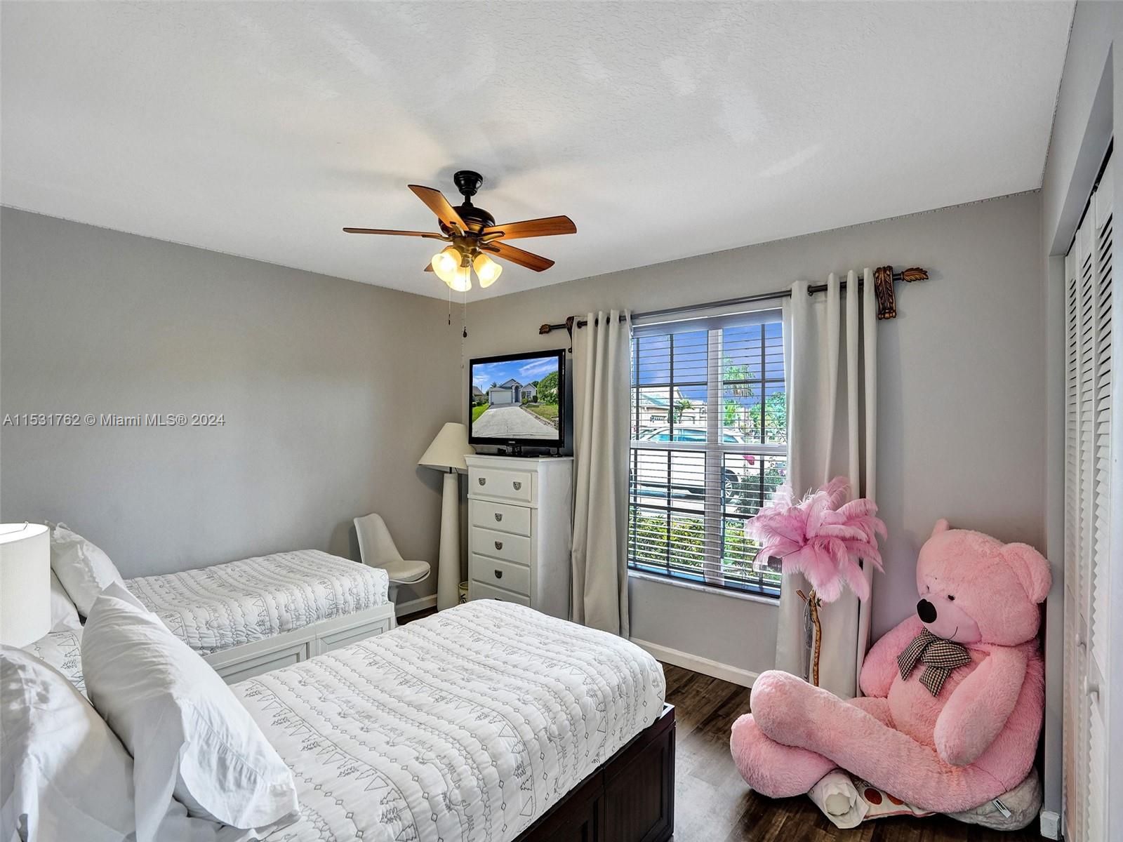 Greenacres Greenacres, FL 33413 - Photo 31 of 61 a bedroom with two beds and a large window