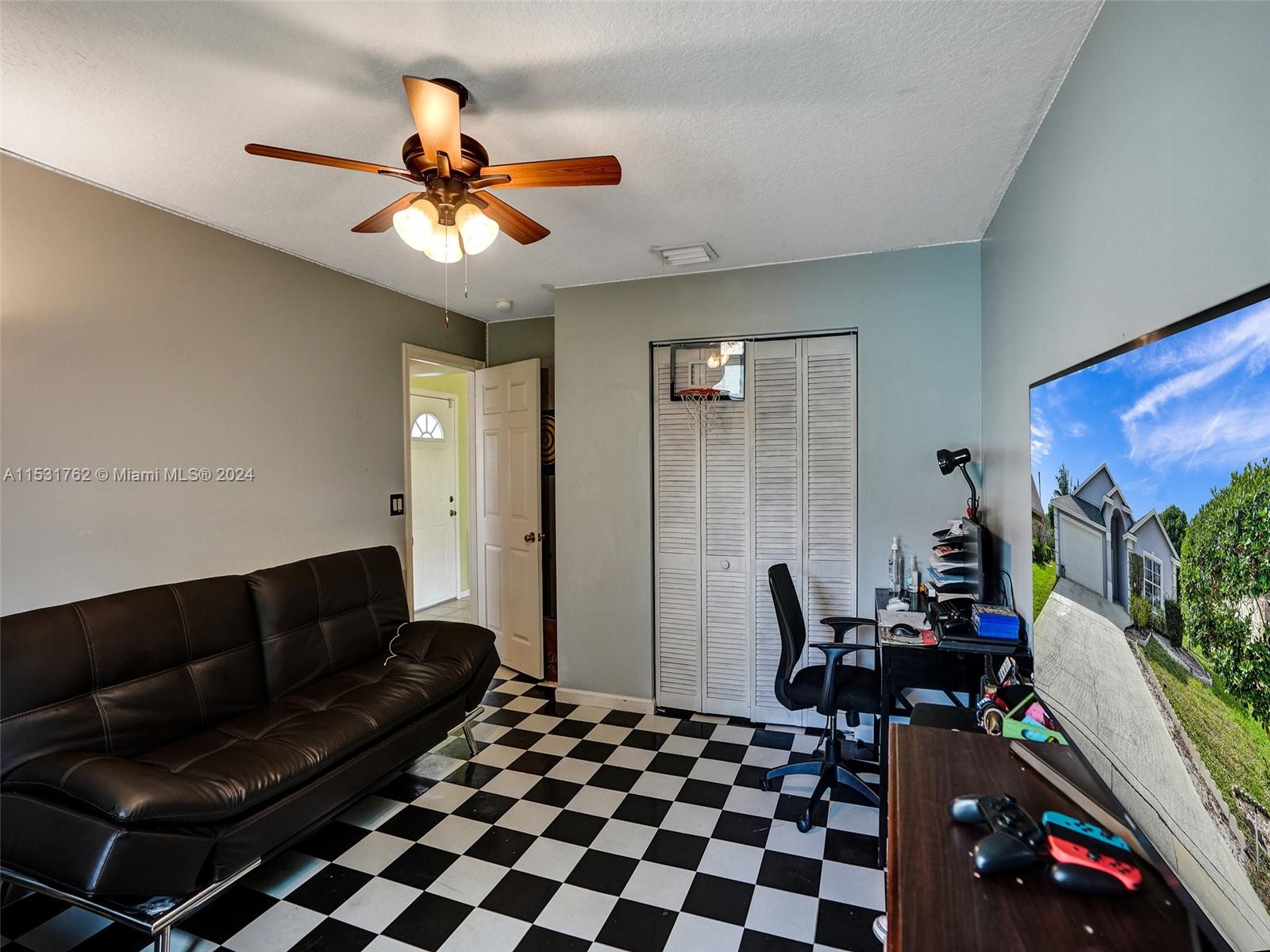 Greenacres Greenacres, FL 33413 - Photo 38 of 61 a living room with furniture and a chandelier
