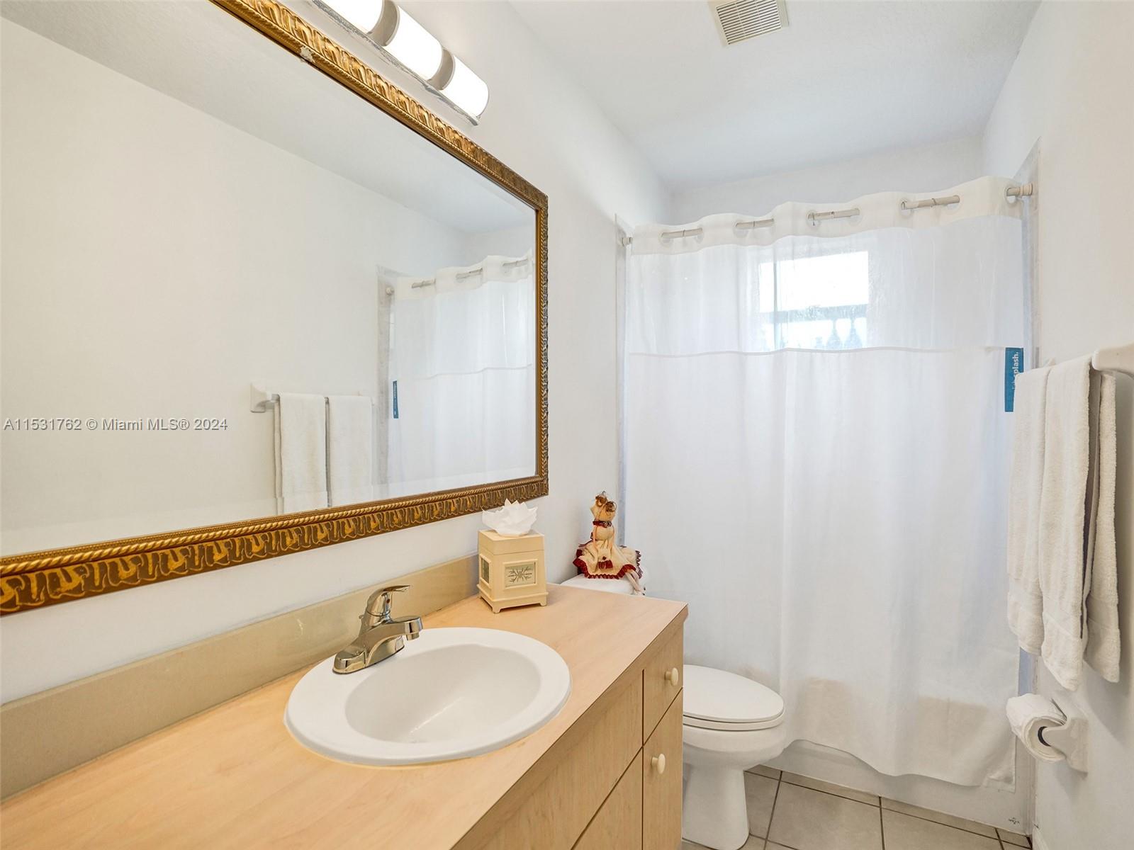 Greenacres Greenacres, FL 33413 - Photo 39 of 61 a bathroom with a sink toilet and shower