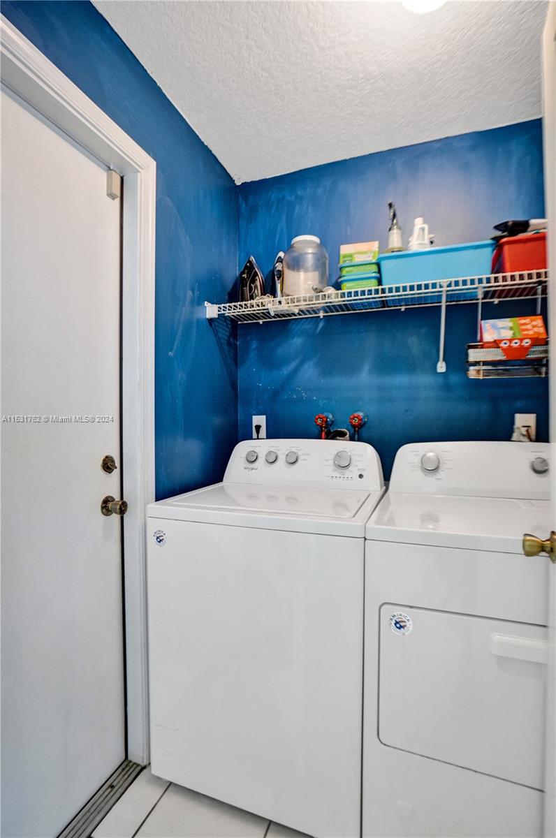Greenacres Greenacres, FL 33413 - Photo 42 of 61 a utility room with dryer and washer
