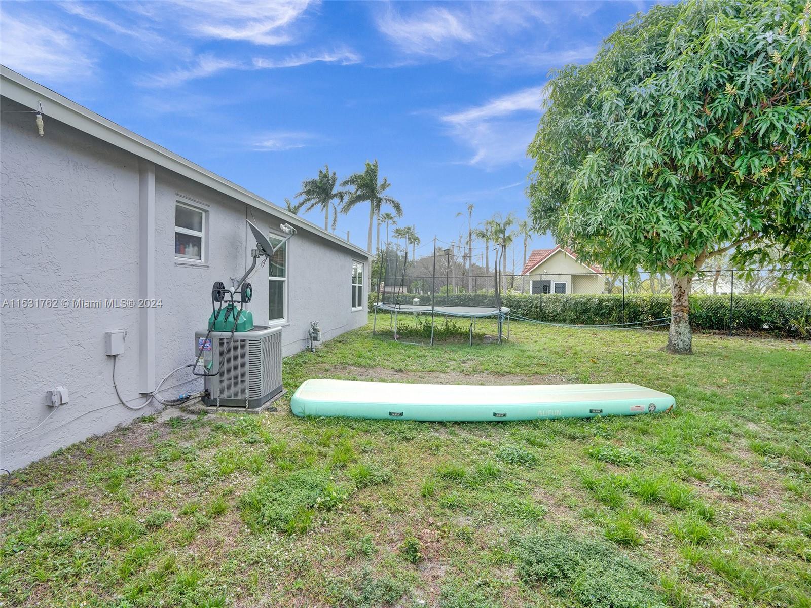 Greenacres Greenacres, FL 33413 - Photo 47 of 61 a view of a house with a yard
