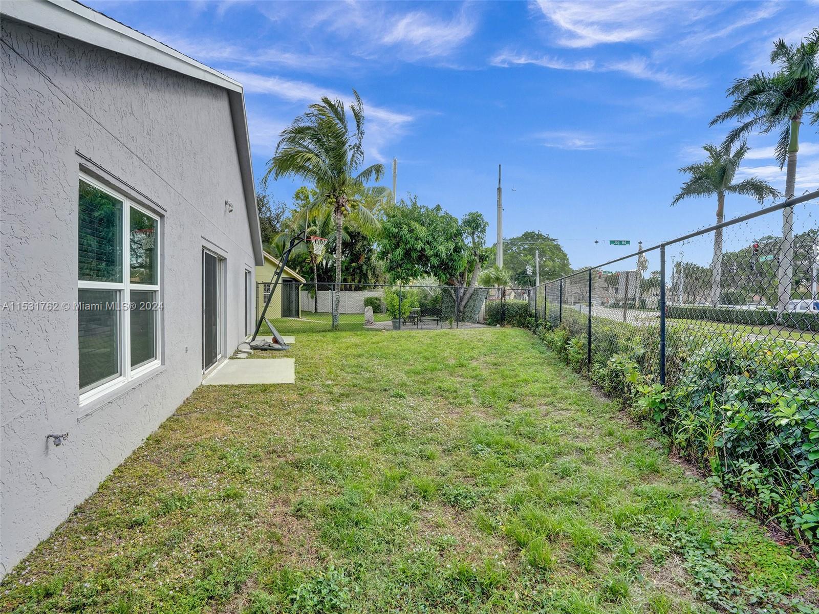 Greenacres Greenacres, FL 33413 - Photo 48 of 61 a view of a yard in front of a house with a big yard