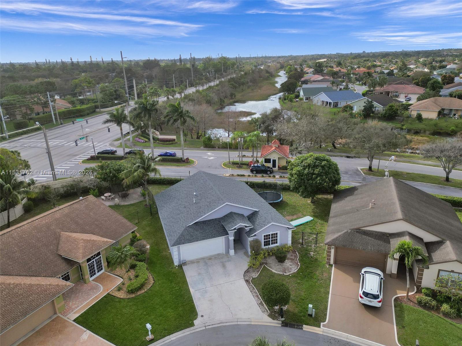 Greenacres Greenacres, FL 33413 - Photo 49 of 61 an aerial view of a house with garden space and street view