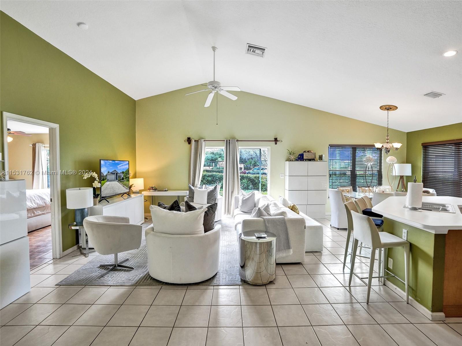 Greenacres Greenacres, FL 33413 - Photo 5 of 61 a living room with furniture and a chandelier