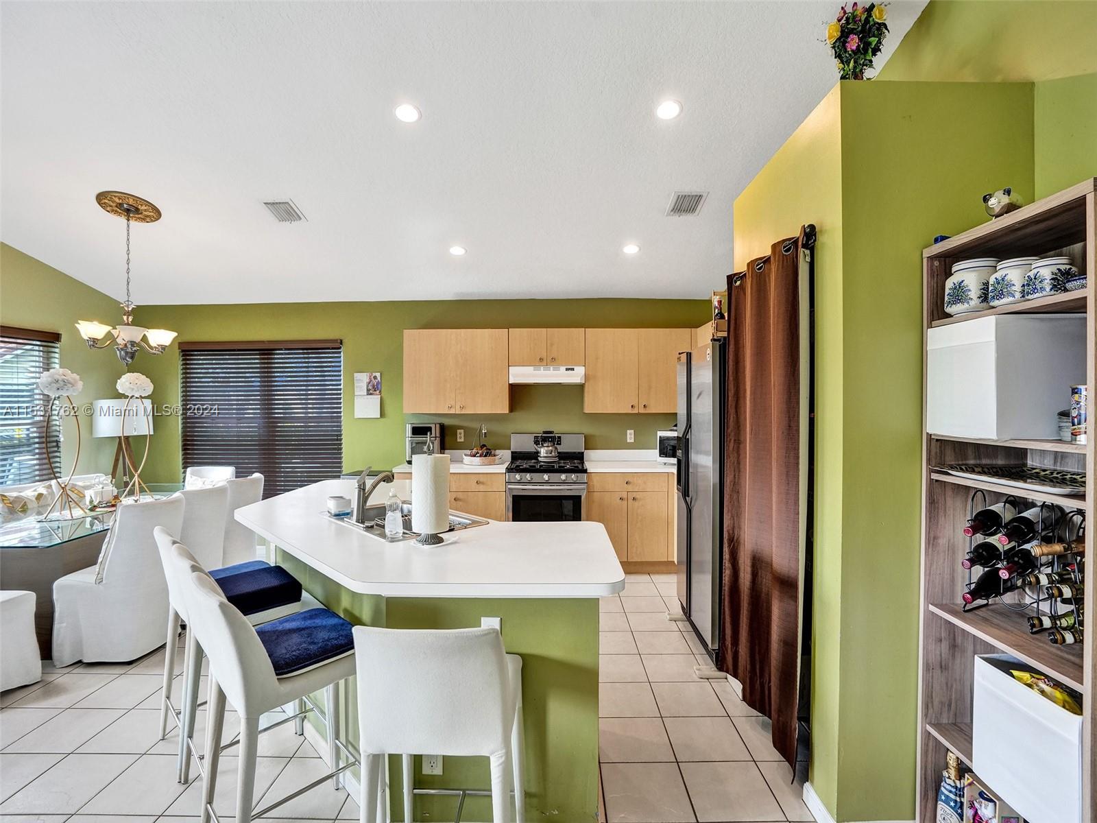 Greenacres Greenacres, FL 33413 - Photo 8 of 61 a kitchen with a table and chairs