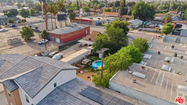 a view of a house with a backyard and a water fountain