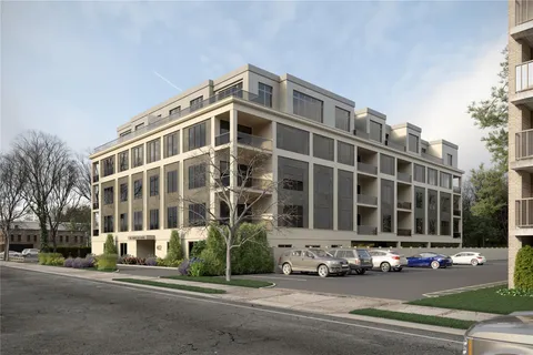 a front view of a building with street view