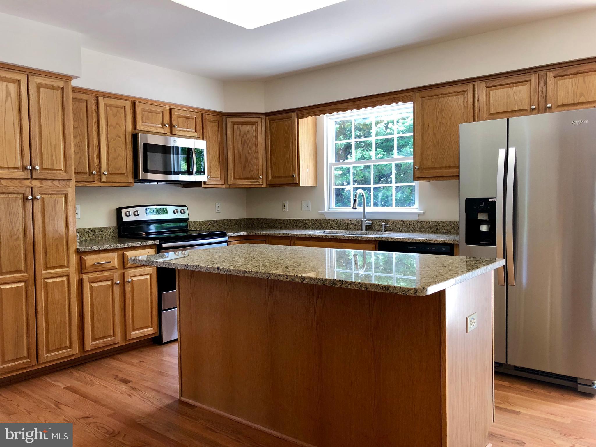 8060 Stone Ridge Drive Frederick, MD 21702 - Photo 3 of 18 LOTS OF CABINET STORAGE AND KITCHEN ISLAND