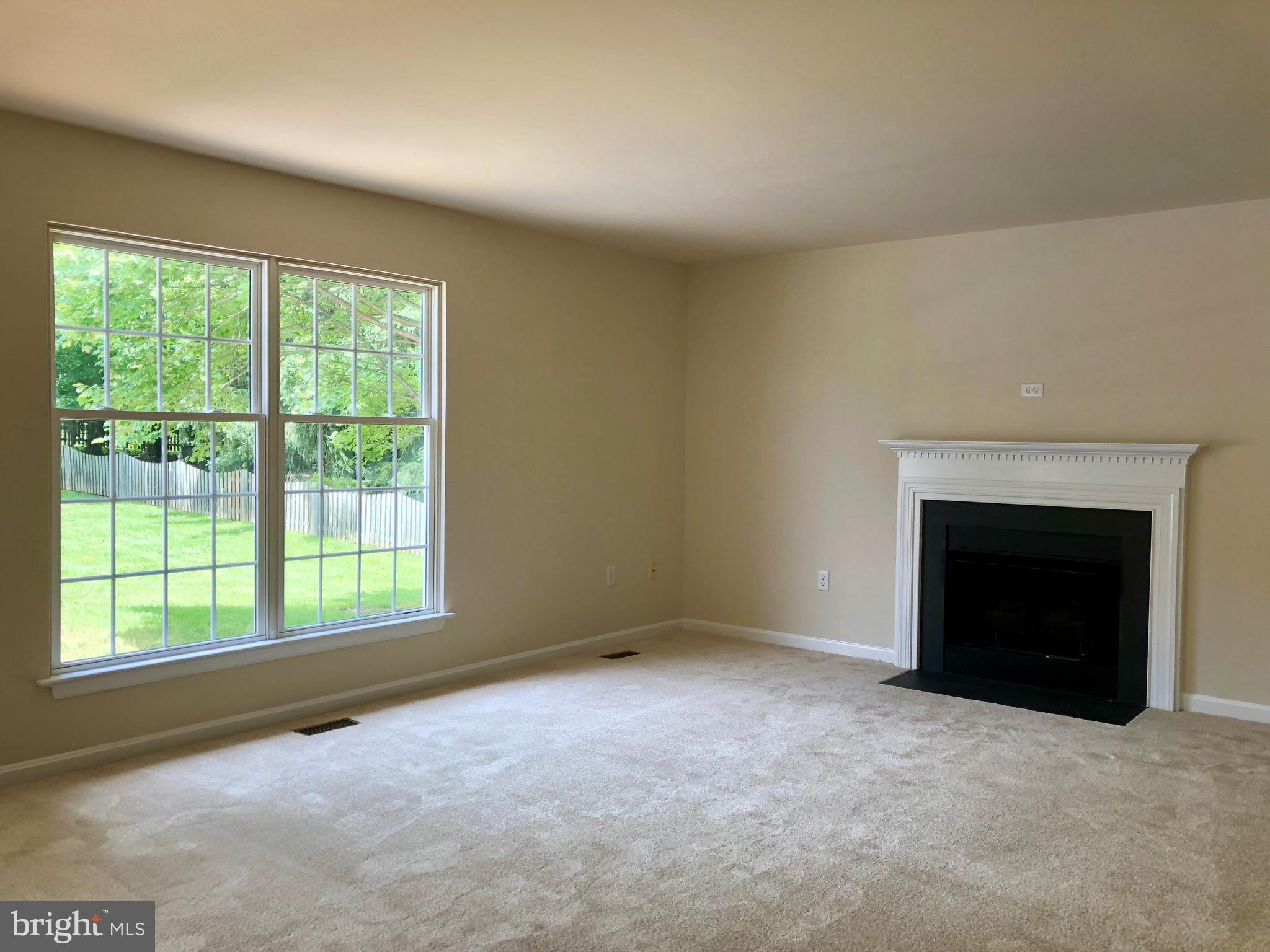 8060 Stone Ridge Drive Frederick, MD 21702 - Photo 9 of 18 OPEN FAMILY ROOM & KITCHEN WITH GAS FIREPLACE