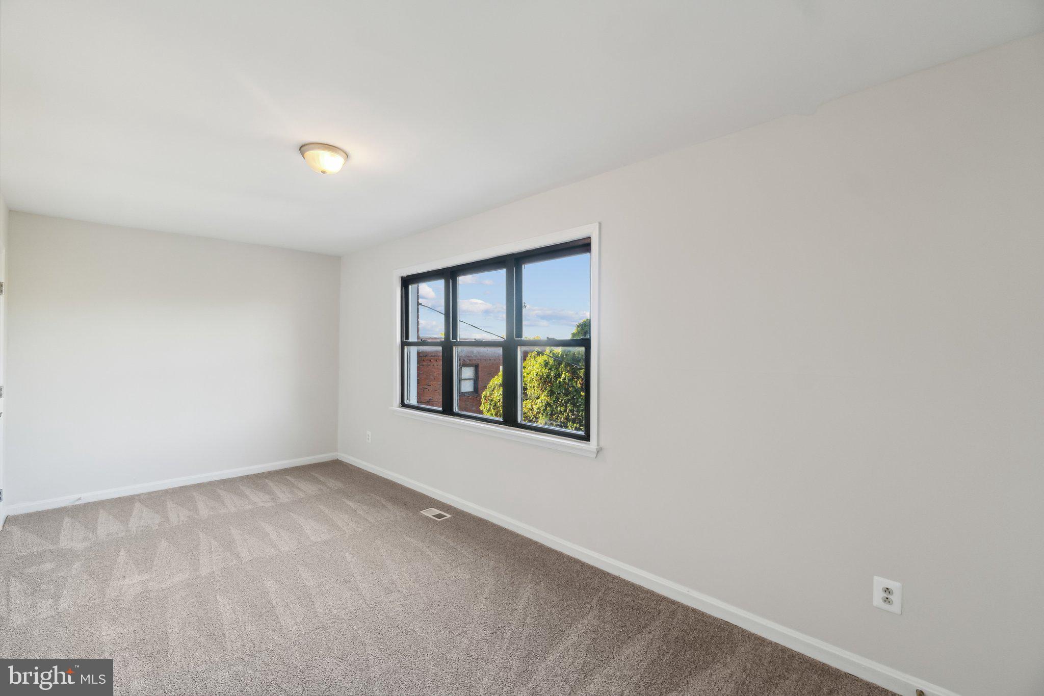 5047 Sheriff Road Northeast Washington, DC 20019 - Photo 13 of 20 Light filled master bedroom