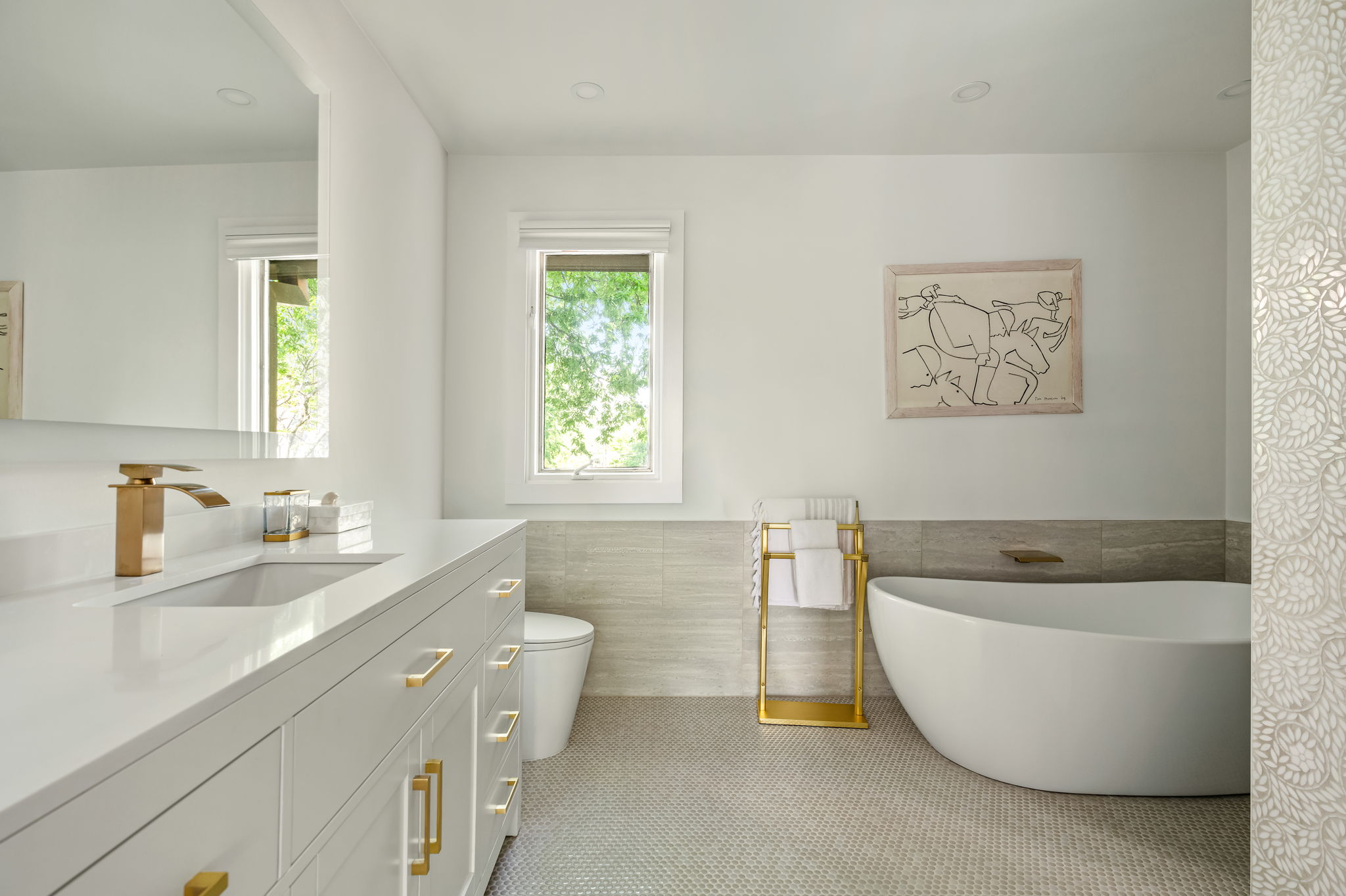 1111 West 12th Street, Unit 107 Austin, TX 78703 - Photo 28 of 38 Modern bathroom featuring a freestanding soaking tub and a vanity with a white countertop