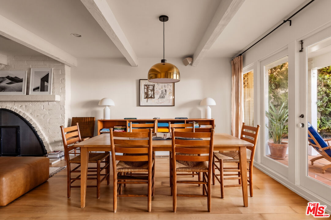 23422 Malibu Colony Road, Unit 98 Malibu, CA 90265 - Photo 18 of 42 a view of a dining room with furniture window and wooden floor