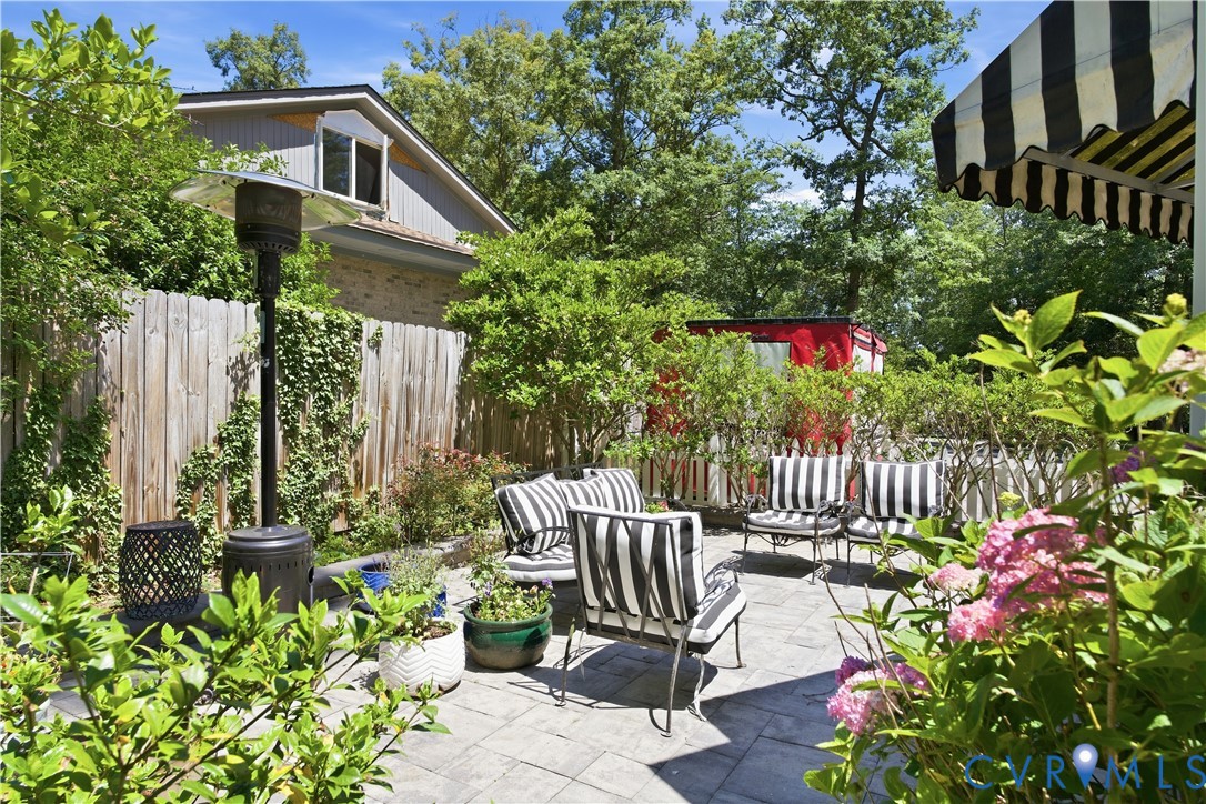 6405 Buckhill Road Richmond, VA 23225 - Photo 44 of 71 Paved patio area featuring lush landscaping and a