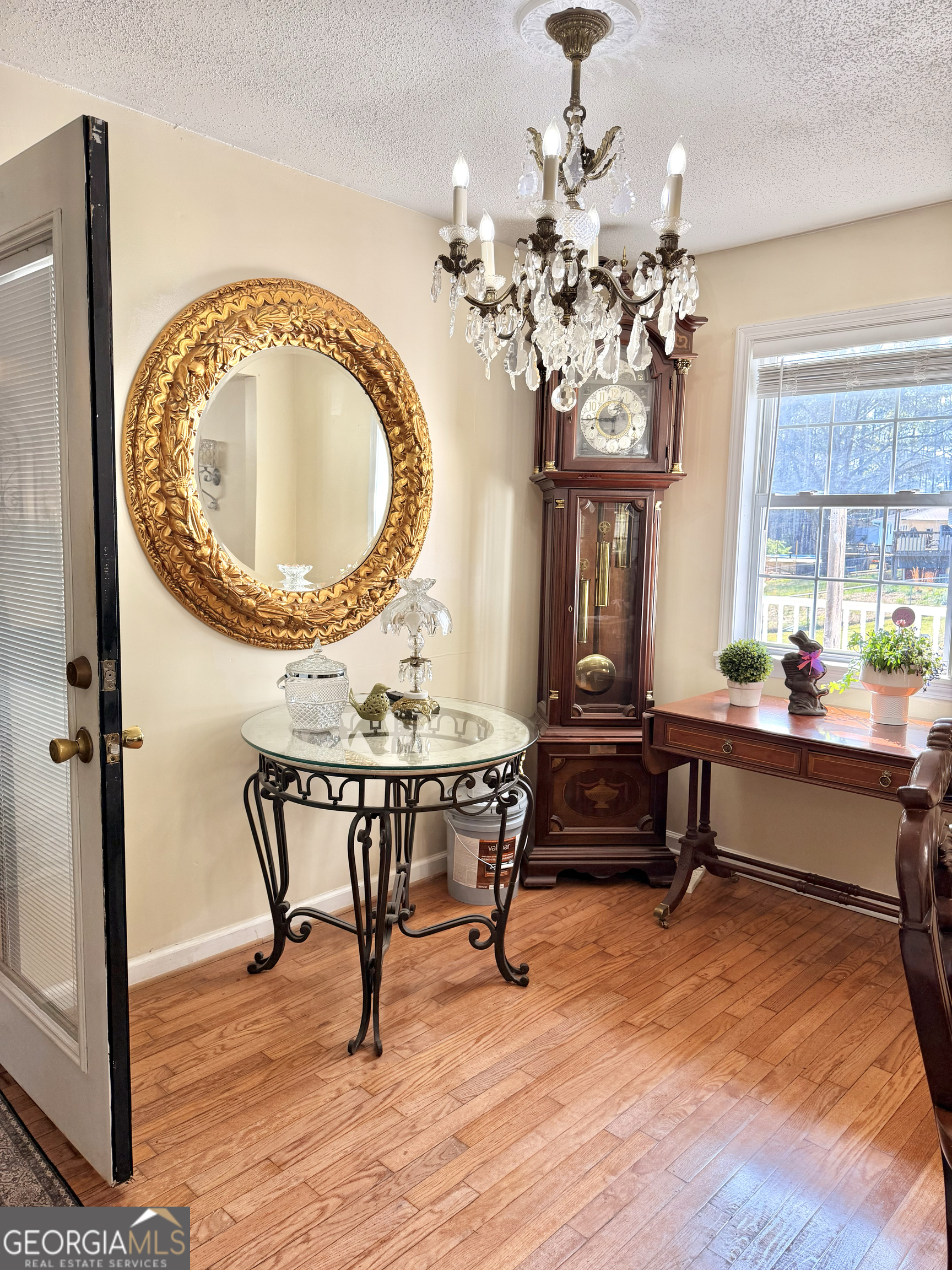 240 Ray Street Tallapoosa, GA 30176 - Photo 30 of 90 a view of a dining room with furniture a chandelier and wooden floor
