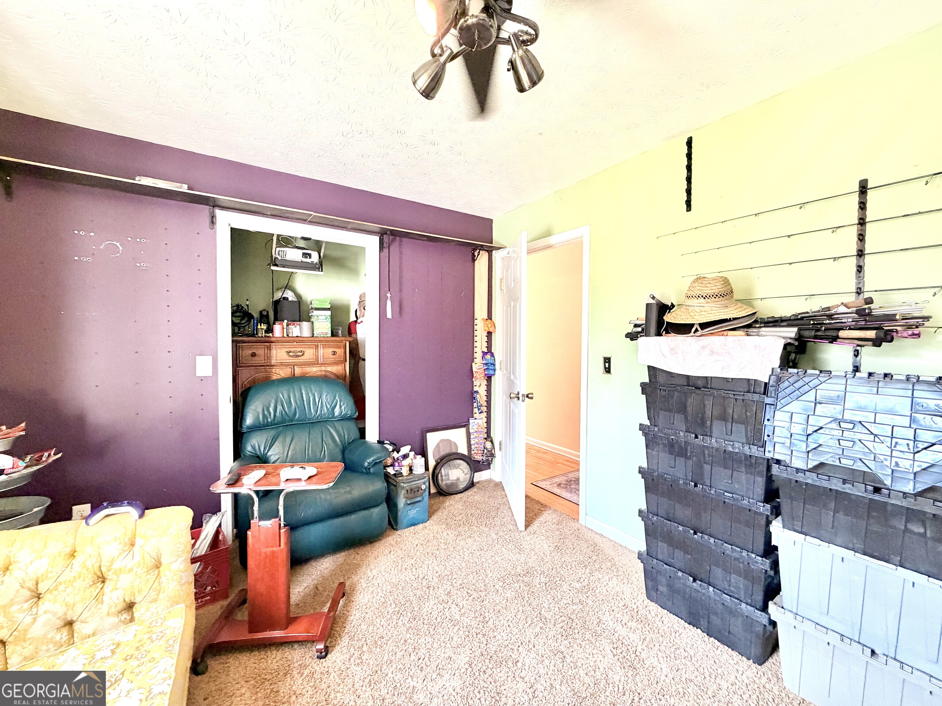 240 Ray Street Tallapoosa, GA 30176 - Photo 82 of 90 a bedroom with a bed and a chandelier