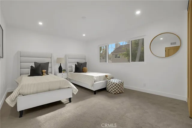 a bathroom with a sink toilet and mirror