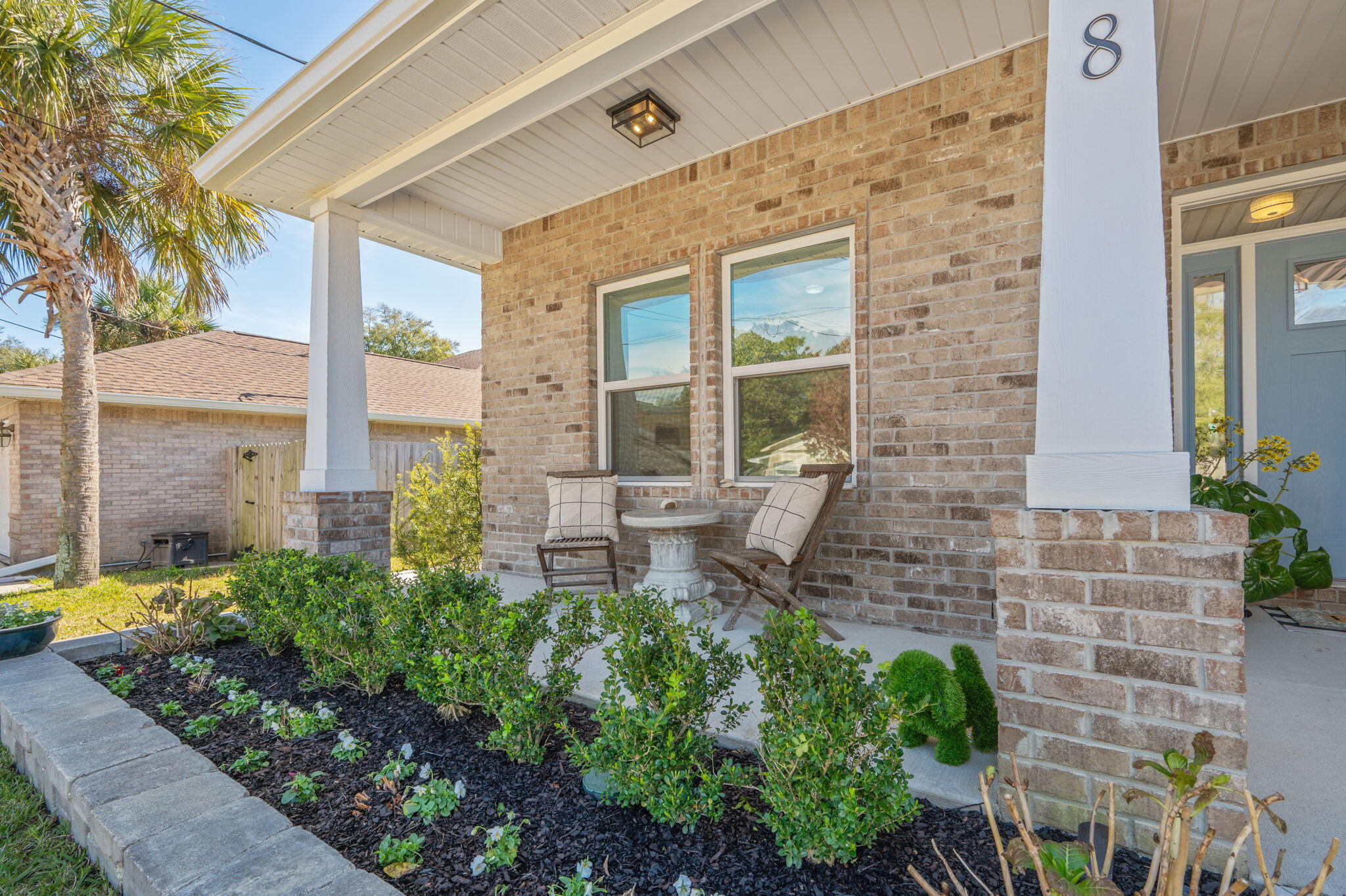 8 Maple Avenue Shalimar, FL 32579 - Photo 2 of 71 a front view of a house with a garden